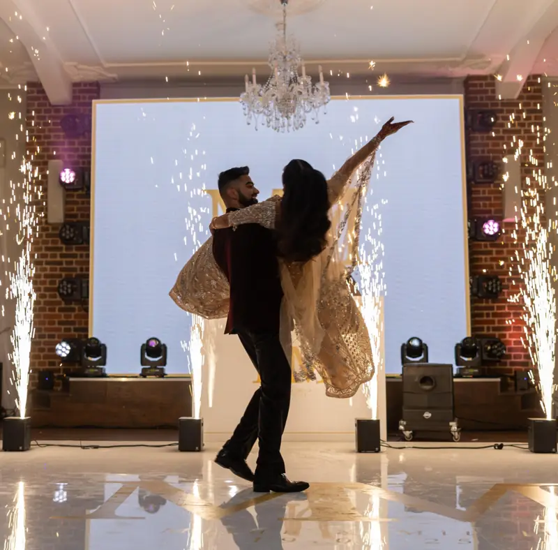 A couple's first dance between cold sparks