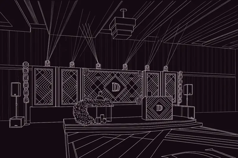 Line drawing of the stage design: five panels with a diamond monogram, moving heads above, pixel columns and speakers either side
