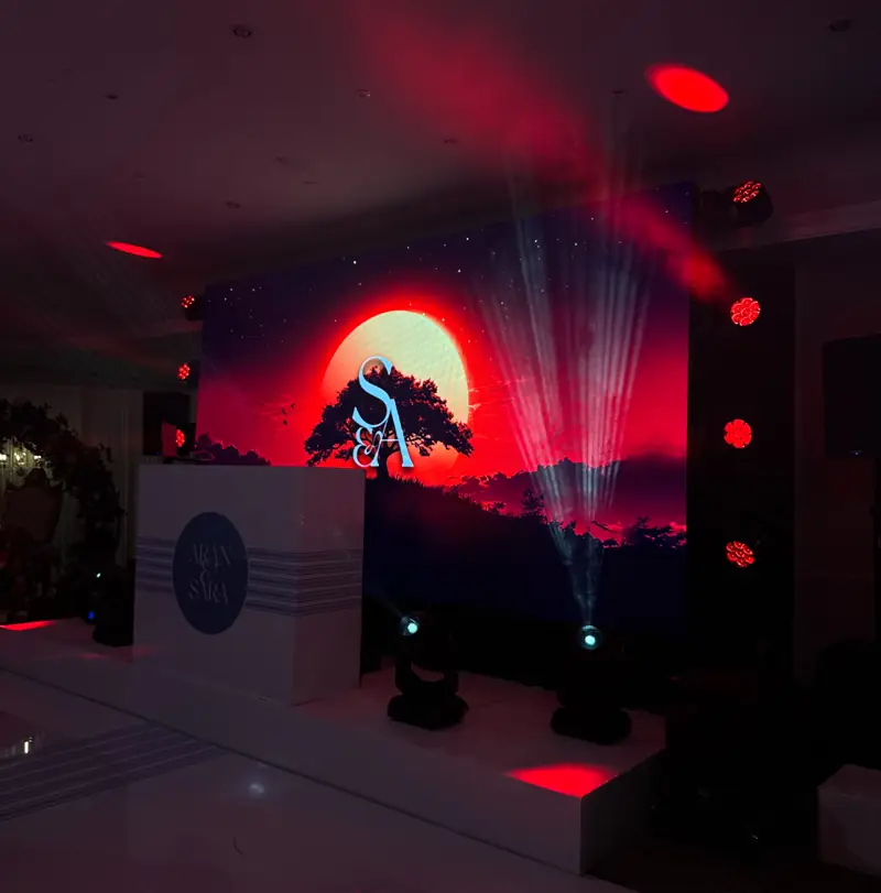 Stage with sunset artwork on the LED backdrop